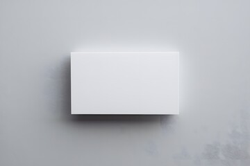 Blank white rectangular signboard mounted on a wall, suitable for advertisements or signage

