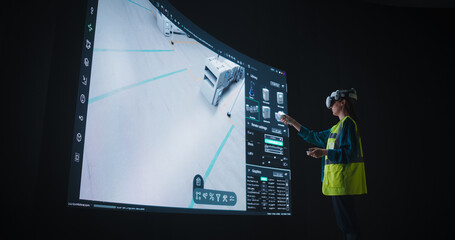 Robotics Specialist Manipulates a Conveyor Line with the Help of Virtual Reality Interface....
