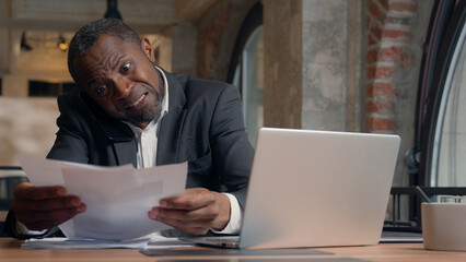 Angry stressed African American adult manager worker in office ethnic businessman stress man...