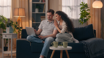 Smiling happy multiracial couple multiethnic Caucasian man male guy husband boyfriend with Hispanic...