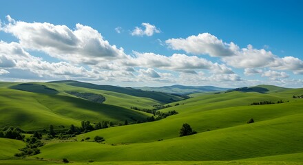 Obraz premium Rolling green hills under a bright blue summer sky