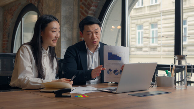 Asian financial marketing workers coworkers colleagues business presentation statistic data Korean Japanese woman girl female businesswoman with Chinese male guy man businessman talk video call office - Powered by Adobe