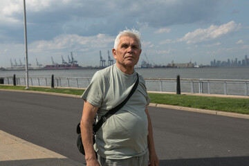 Active Senior Man Traveling  in New York City.  A 75-year-old man explores the streets of New York City, embracing adventure and independence in his golden years.