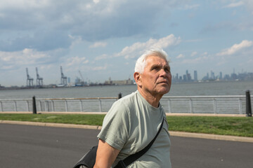 Active Senior Man Traveling  in New York City.  A 75-year-old man explores the streets of New York City, embracing adventure and independence in his golden years.