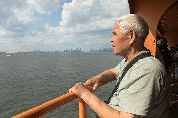 Active Senior Man Traveling  in New York City.  A 75-year-old man explores the streets of New York City, embracing adventure and independence in his golden years.