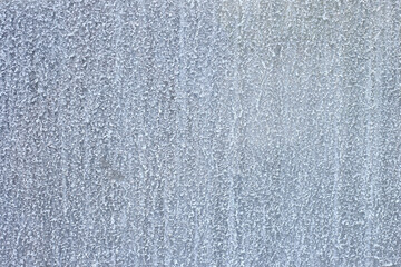 Close-up of glass surface with water stains and mineral residue. Transparent texture showing moisture, condensation, and unclean surface.