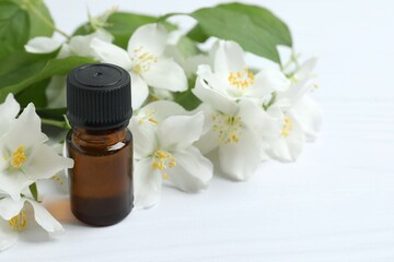 Jasmine essential oil with fresh jasmine flowers - cosmetic care