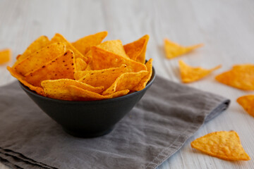 Crunchy Nacho BBQ Tortilla Chips in a Bowl, side view. Close-up.