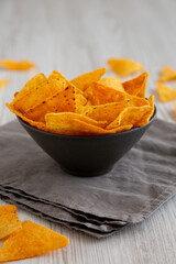 Crunchy Nacho BBQ Tortilla Chips in a Bowl, low angle view.