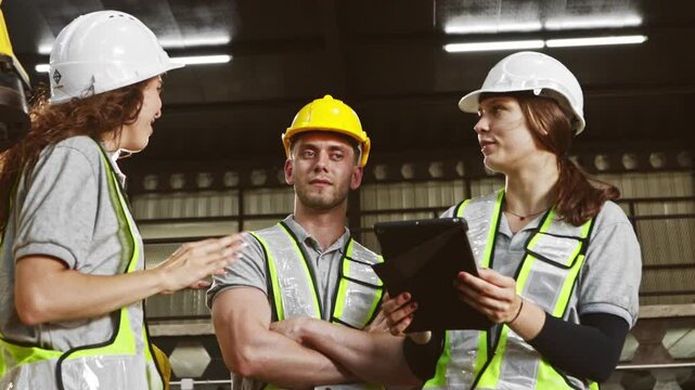 Group male and female robot engineers meet plan and inspect the work large robot site talk and understand offer ideas and listen their opinions so that the work can be completed as planned.
