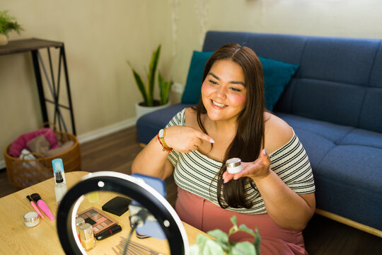Plus size influencer making beauty content video for social media