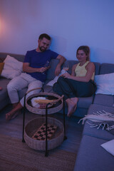 Relaxed Couple Enjoying Wine at Home in the Evening