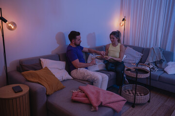Relaxed Couple Enjoying Wine at Home in the Evening