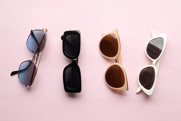 Sunglasses on a plain background. Summer, chamomile