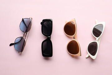 Sunglasses on a plain background. Summer, chamomile
