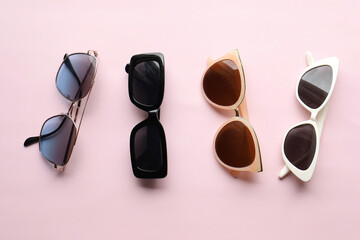 Sunglasses on a plain background. Summer, chamomile