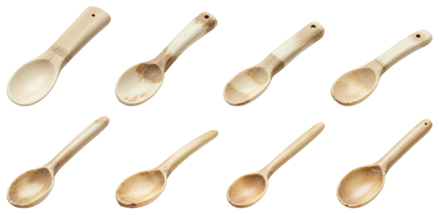 Carved and polished wooden spoons on transparent background