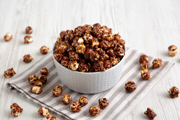 Homemade Chocolate Caramel Popcorn Ready to Eat in a Bowl, side view.