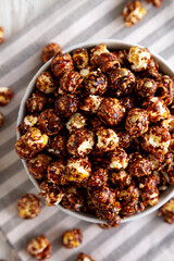 Homemade Chocolate Caramel Popcorn Ready to Eat in a Bowl, top view.