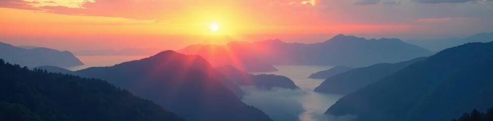 Misty sunrise illuminates mountain range, shadows lengthen below, color, range