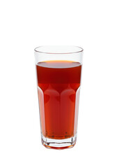 A glass filled with a reddish-brown liquid, likely tea or juice, against a stark black background