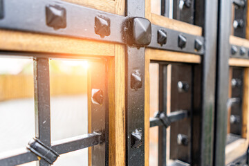 Selective focus, texture of a metal old lattice fence against the blue sky, fence lattice, lattice background, cell. High quality photo