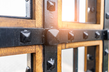 Selective focus, texture of a metal old lattice fence against the blue sky, fence lattice, lattice...