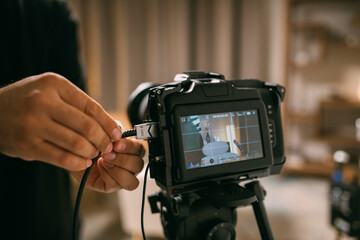 The interior of a recording studio is equipped with professional filming equipment for recording...