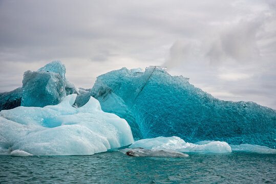 Icebergs in Jokulsarlon glacial lagoon in Iceland. - Powered by Adobe
