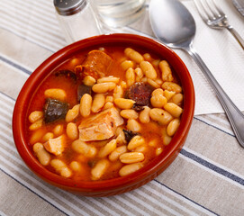Tasty homemade stew of asturian beans with sausages. Traditional Spanish cuisine