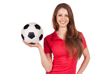 Girl in jeans with soccer ball.