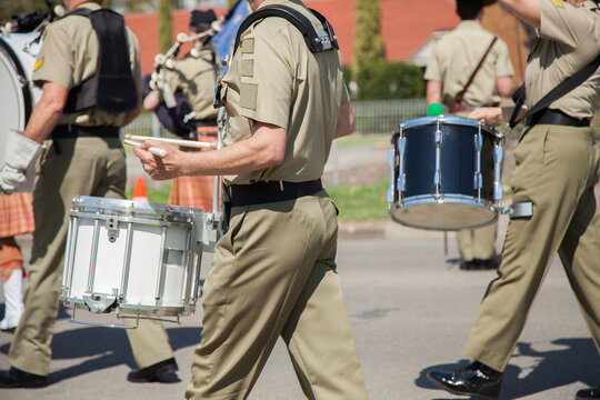 Army drum players marching down the road in celebration of freedom of entry