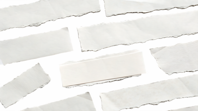 Multiple white torn paper pieces are scattered on a transparent background