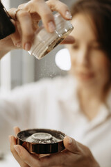 Makeup artist, makeup, powder concept. Makeup artist pours powder. Close-up
