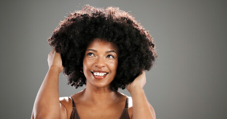Haircare, beauty and woman with afro in studio with healthy texture, growth results or volume....
