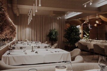 Luxurious restaurant interior with soft lighting and natural accents
