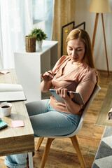 Cozy moments of a young woman enjoying her day at home while using a tablet and sipping coffee