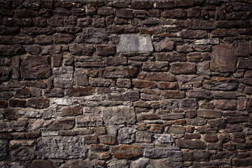 Ancient wall made of different sizes stones.