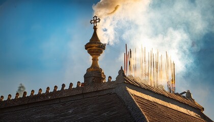 smoke from chimney old church steeple indicating the successful election of a new pope during the papal conclave white smoke rises from the chapel chimney incense sticks in a temple