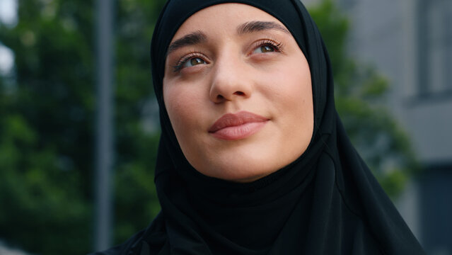 Portrait happy smiling dreaming inspired hopeful mindfulness Muslim positive Islamic woman wearing hijab businesswoman business female girl in city outdoor smile carefree thinking dream religion faith