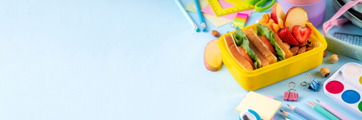 Back to school. Healthy school meal, children packed lunch box with fruit, berry, nuts, sandwich...