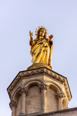 Close-up of golden statue of Maria on top of Avignon Cathedral