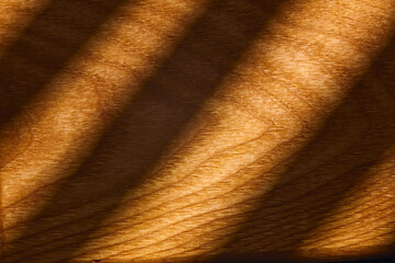 A close-up view of beautifully grained wood reveals rich, warm tones and smooth textures.