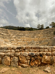 Ancient stone amphitheater surrounded by nature in a historical location