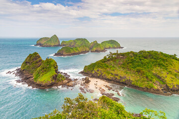 Scenic view of Green Island, Banyuwangi, Indonesia, with lush islets and turquoise waters.