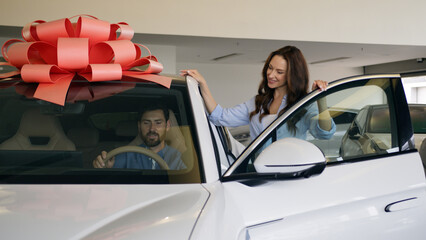 Happy Caucasian family buying new car luxury automobile choosing talking walking man open doors...