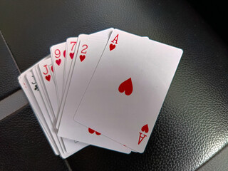 Obraz premium A set of playing cards with the top one as love.