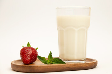 Strawberries, milk on a white background. Healthy food. Milkshake with fresh ingredients