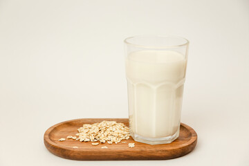 A glass of milk and oatmeal. Quick breakfast. Ingredients for oatmeal