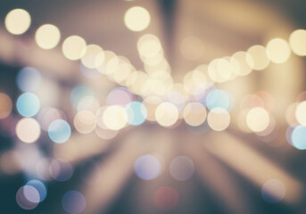 Obraz premium Abstract image of defocused warm bokeh lights creating a dreamy and soft atmosphere, commonly used for festive, celebratory, or romantic visual contexts.